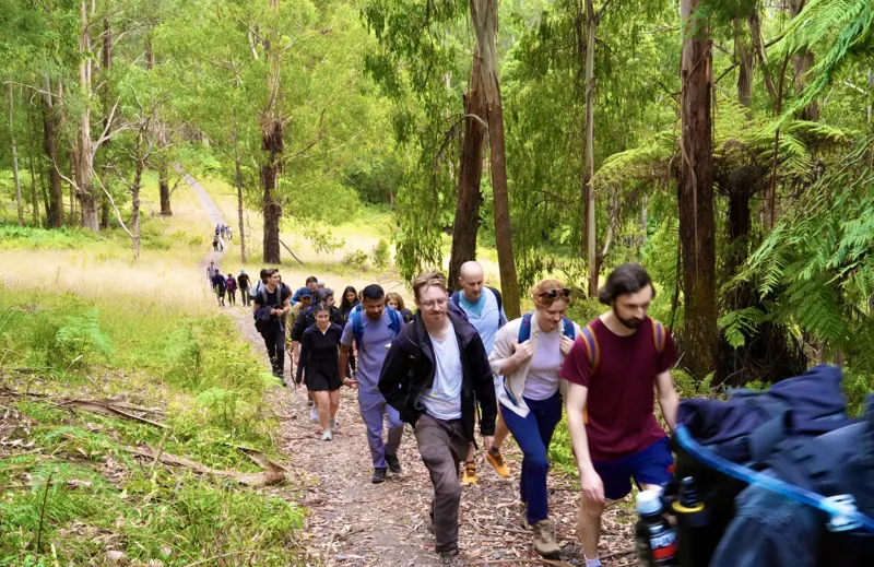 Social Hikes Australia group scrambling over rocks beside the river in Werribee Gorge — photo 4